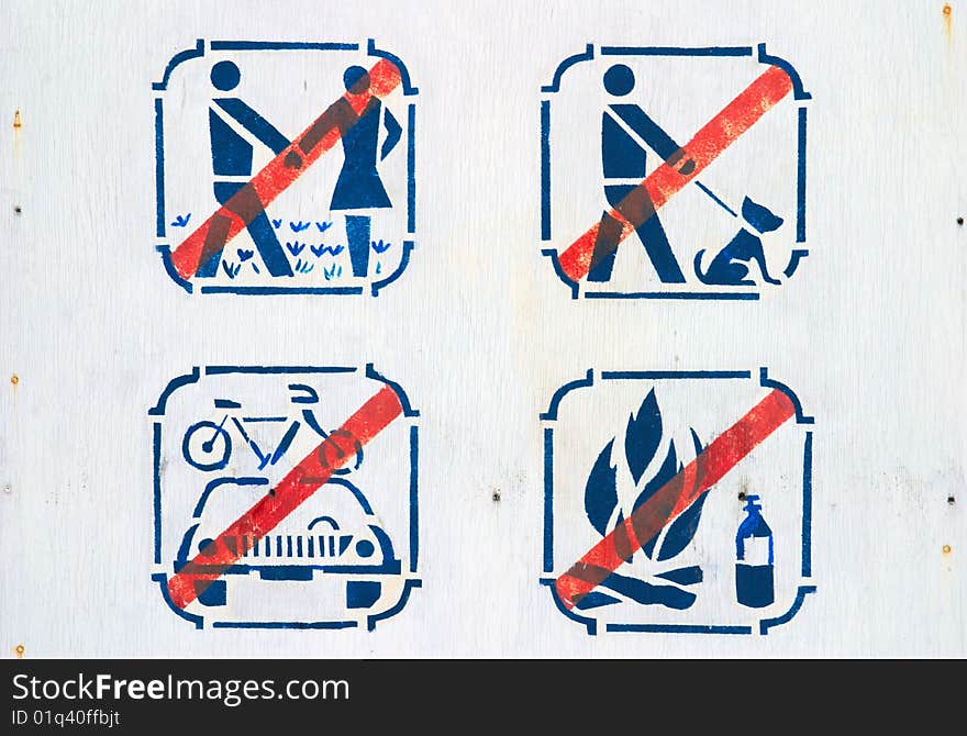 Forbidding pictograms on board in park. Forbidding pictograms on board in park