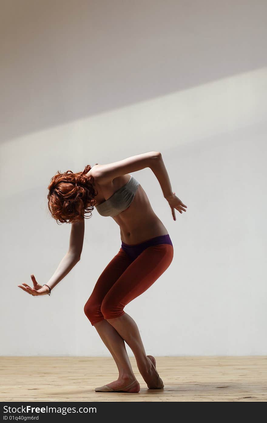 Modern style dancer posing on studio background. Modern style dancer posing on studio background