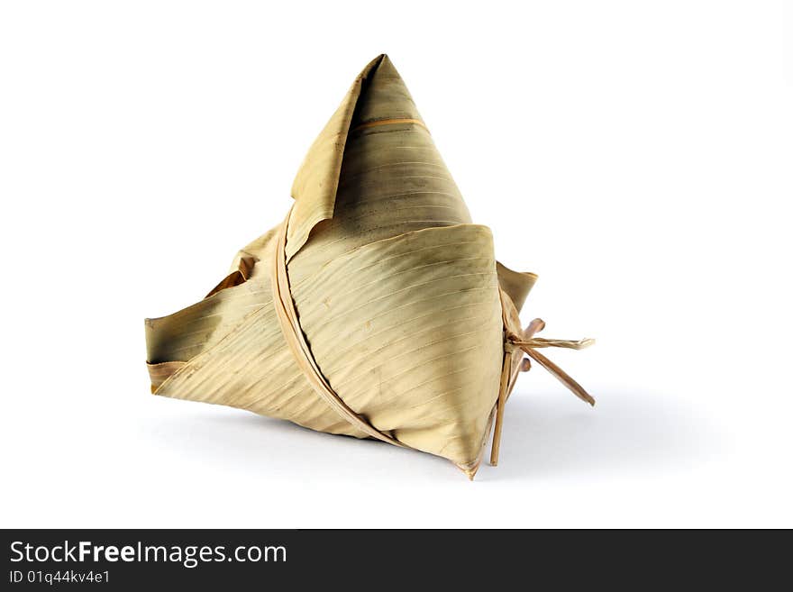 A rice dumplings (Chinese traditional food) isolated on white background. A rice dumplings (Chinese traditional food) isolated on white background.