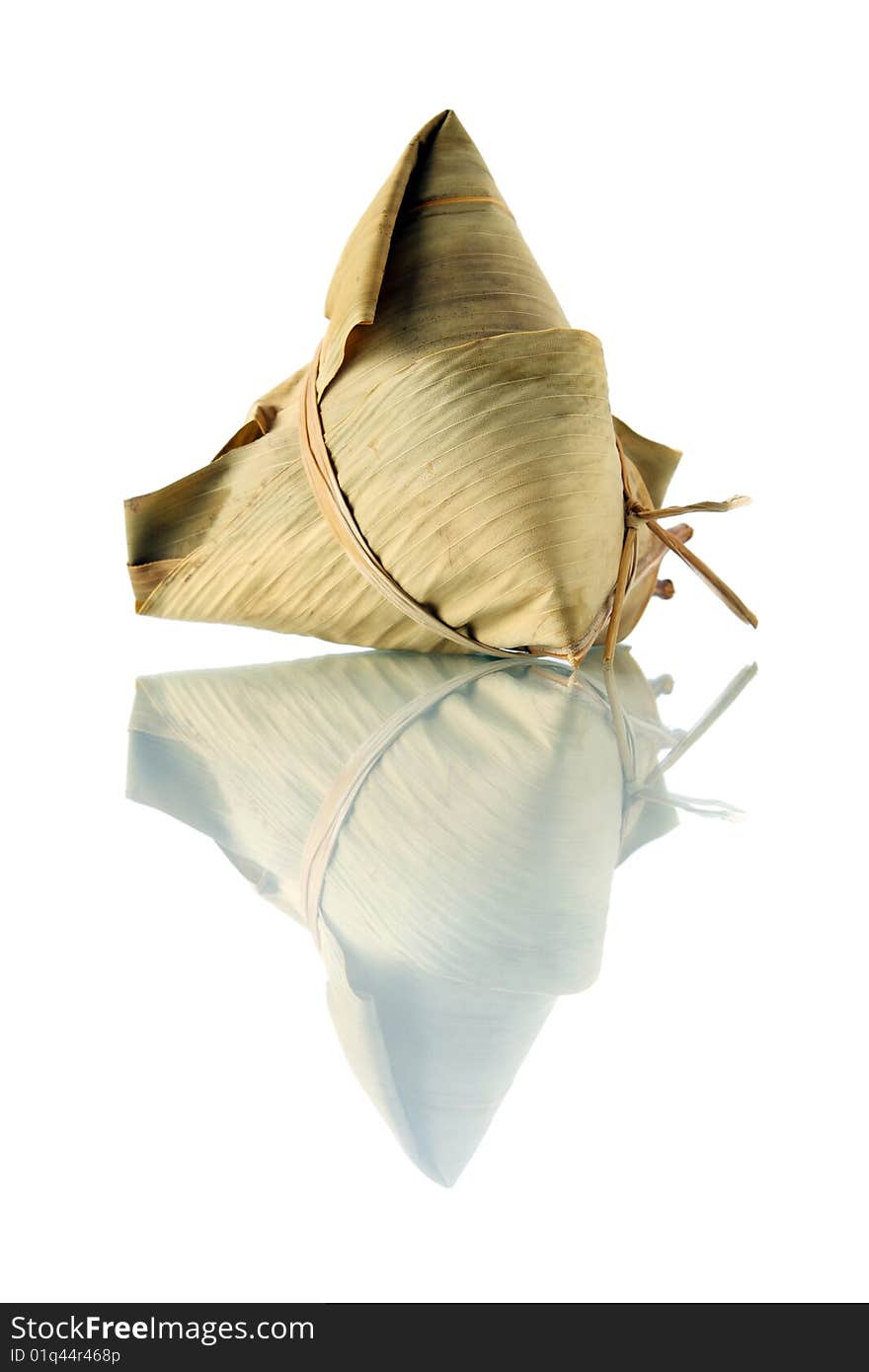 A rice dumplings (Chinese traditional food) isolated on white background. A rice dumplings (Chinese traditional food) isolated on white background.