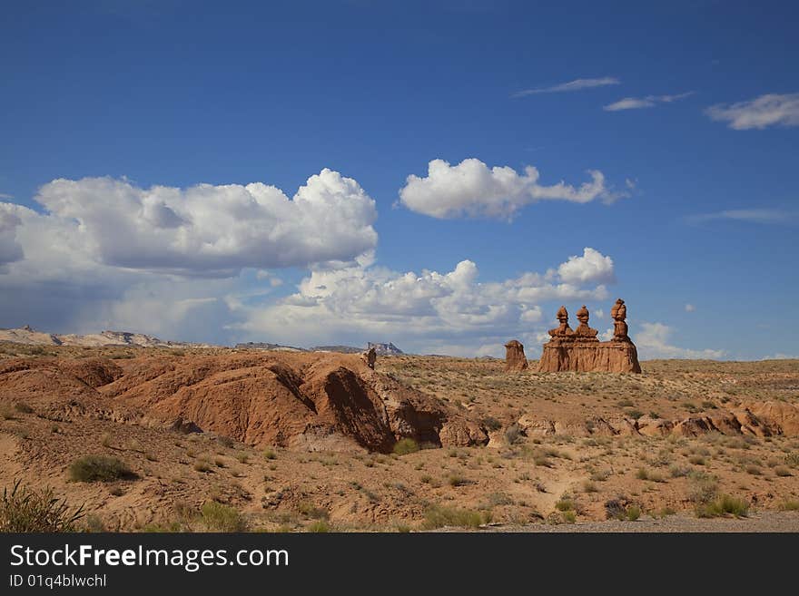 View of red rock formations in San Rafael Swell with blue sky�s the and clouds