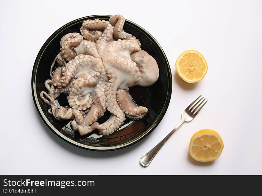 Octopus on a black dish