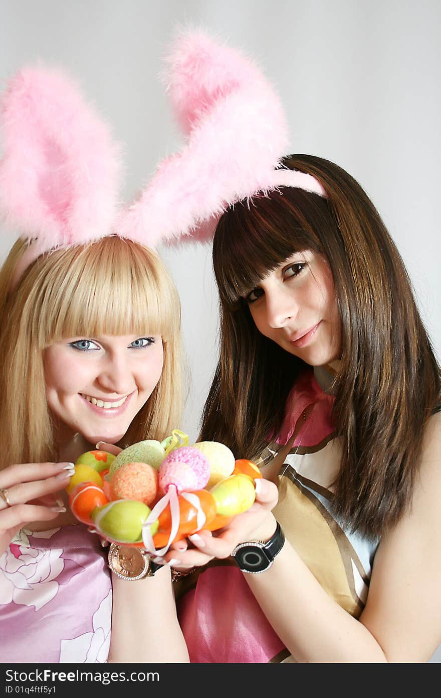 Girl with rabbit ears smiling.