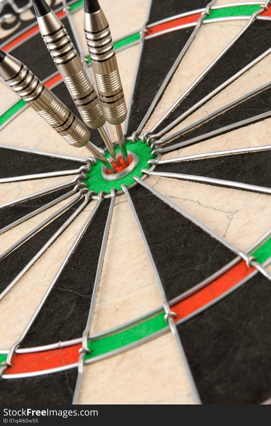 Closeup darts board with arrows