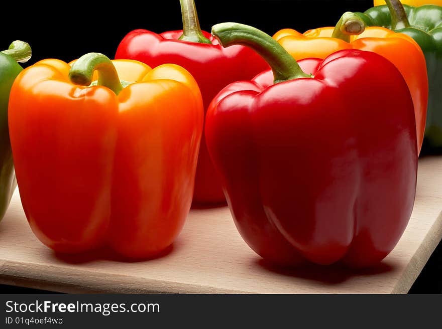 Vegetables - Peppers on cutting board. Vegetables - Peppers on cutting board