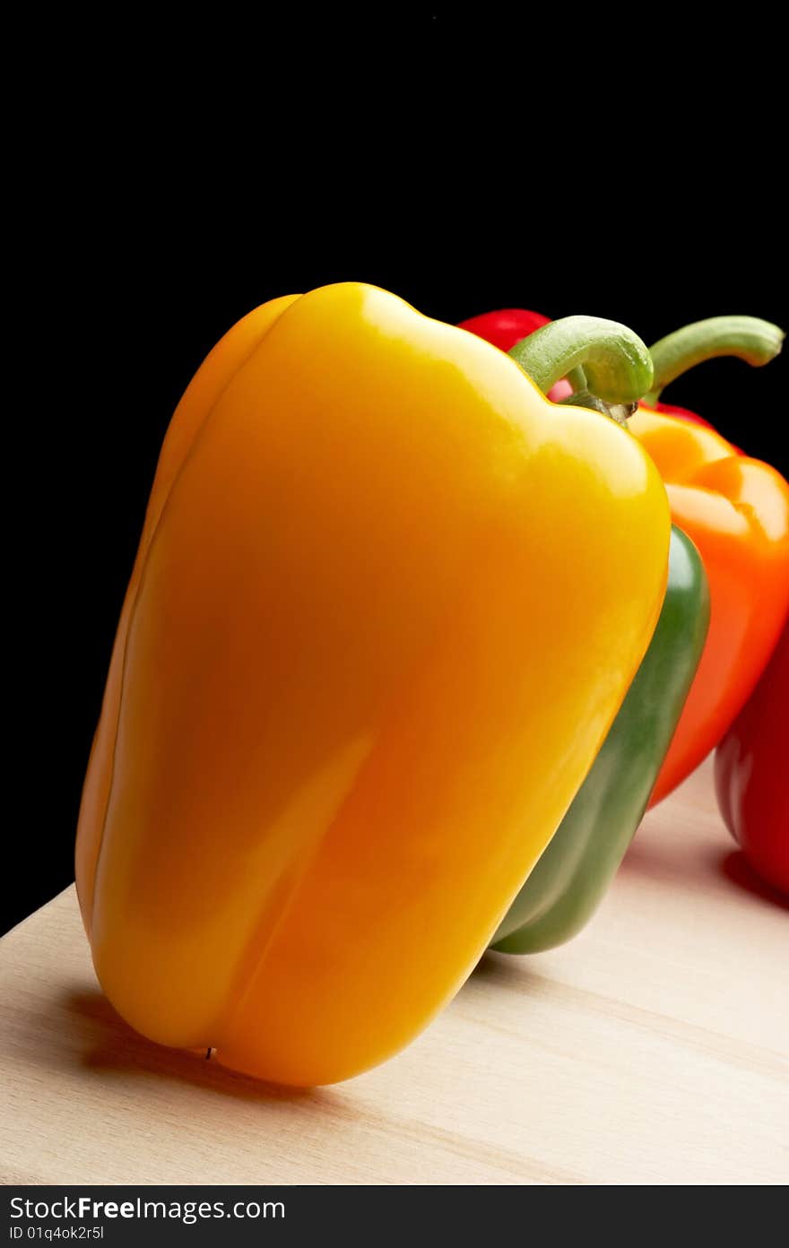 Vegetables - Peppers on black background. Vegetables - Peppers on black background