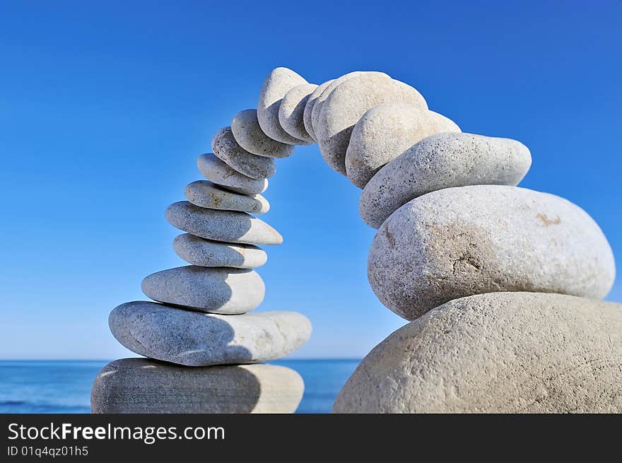 Illuminated arch of gravel on the background of the sky. Illuminated arch of gravel on the background of the sky