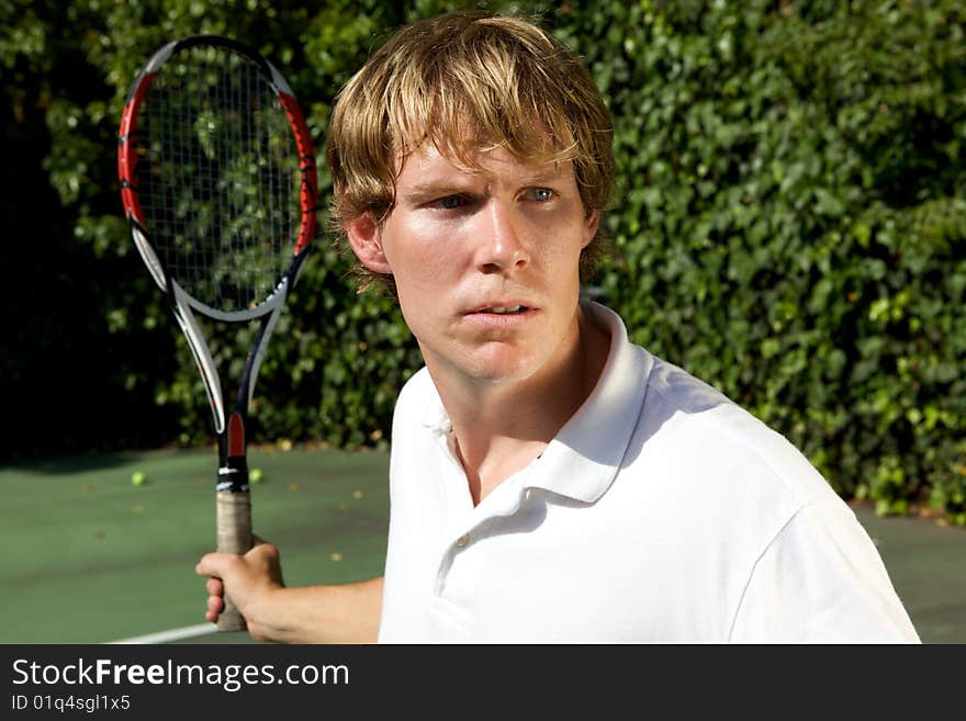 An up close shot of a tennis player ready to hit a forehand back. An up close shot of a tennis player ready to hit a forehand back