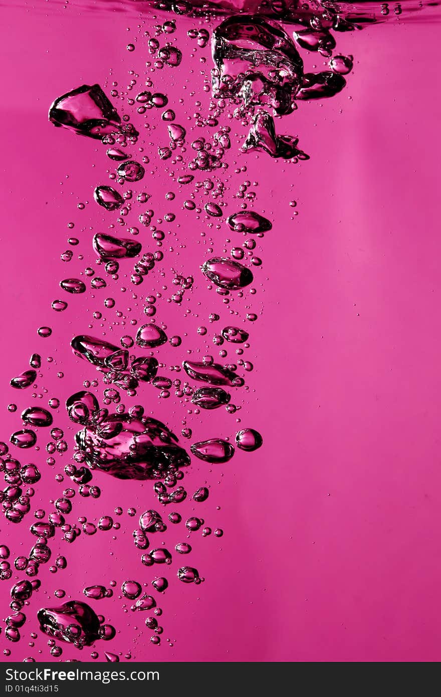 Air bubbles underwater against pink background. Air bubbles underwater against pink background