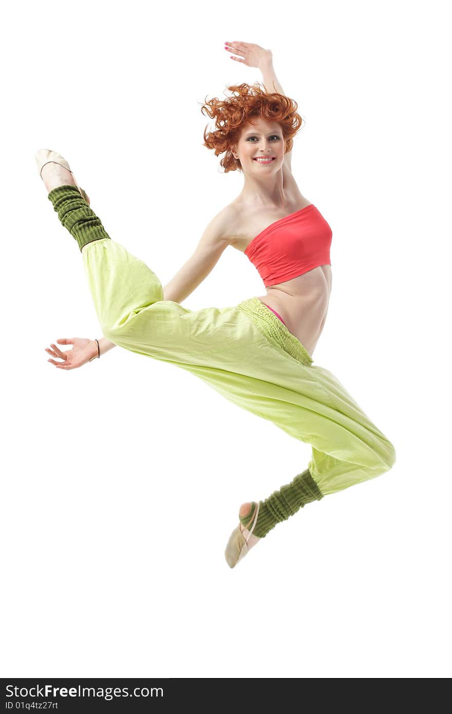 Modern style dancer jumping on studio background