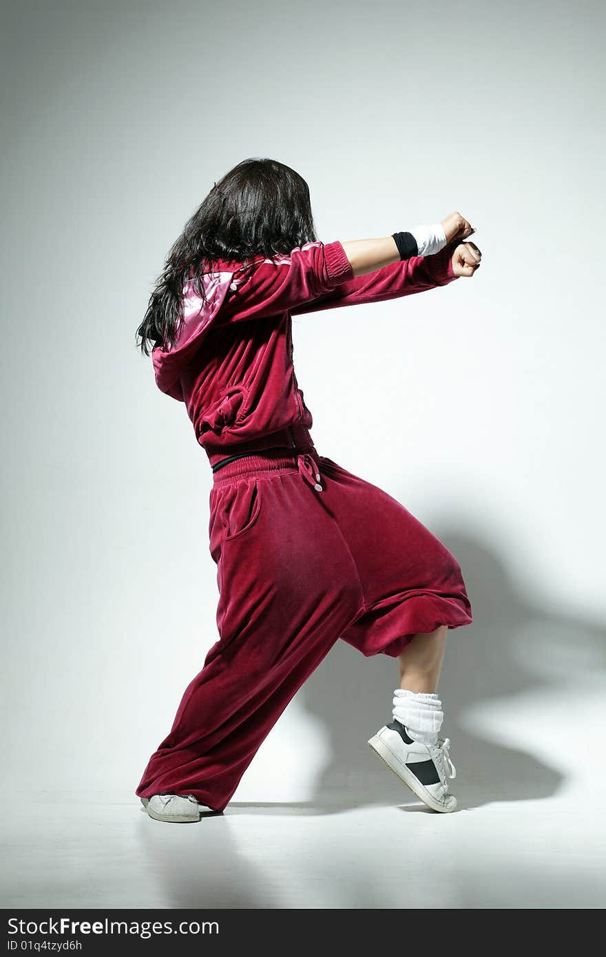 Modern style dancer posing on studio background. Modern style dancer posing on studio background