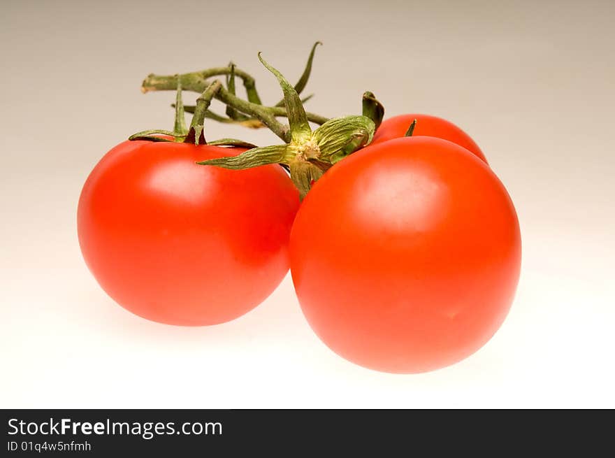 Three red tomatoes