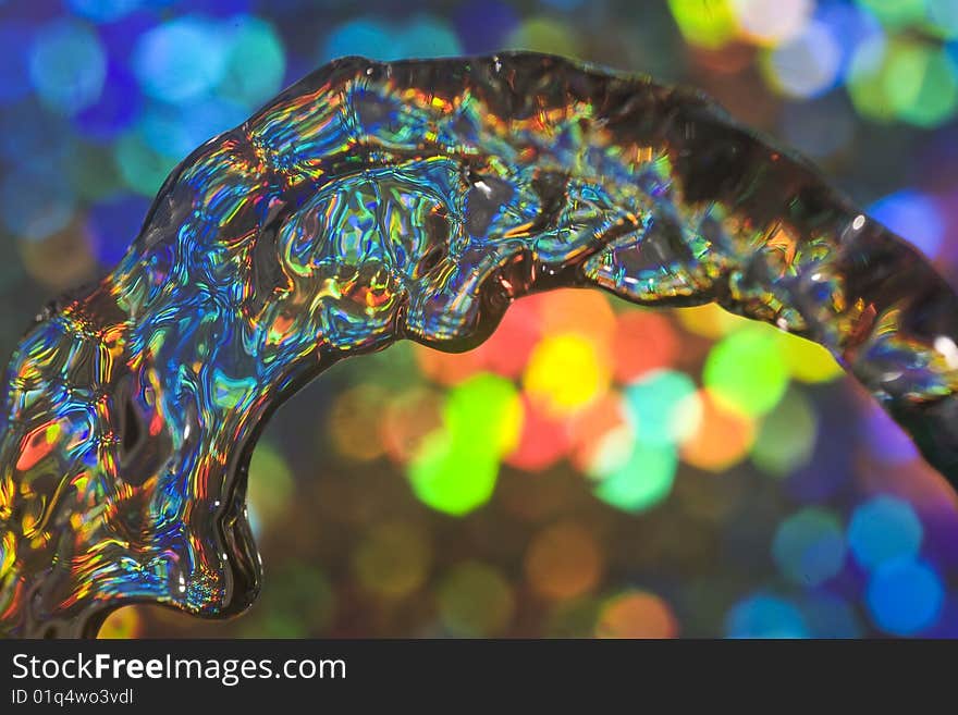 Abstract of flowing water with colourful reflected light. Abstract of flowing water with colourful reflected light