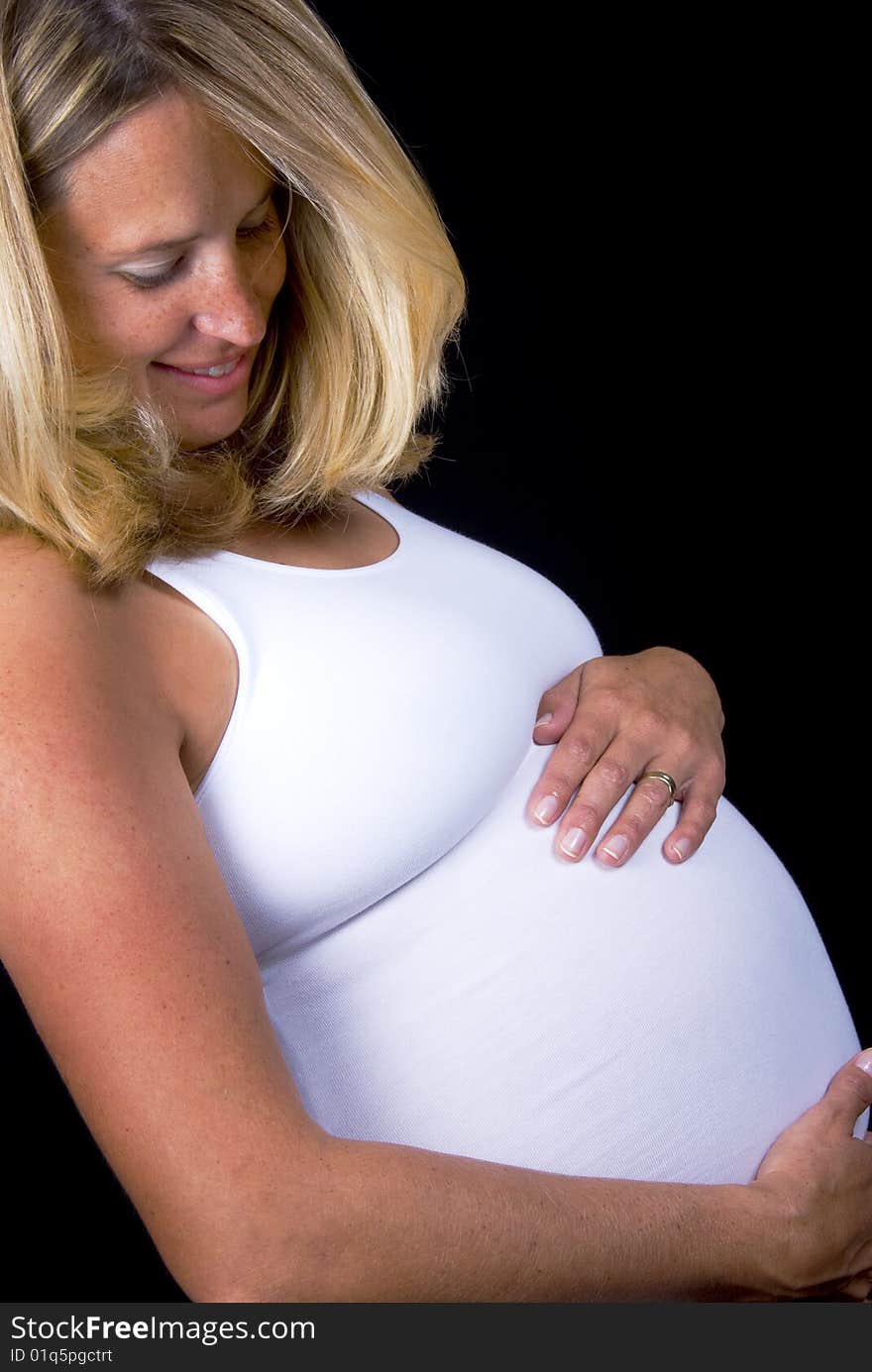 Pregnant woman holding her tummy. Pregnant woman holding her tummy