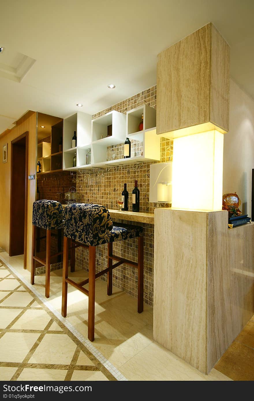 Home bar with counter and stools. Home bar with counter and stools.