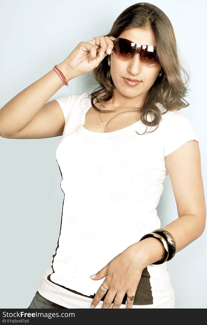 Cute indian girl posing in studio.