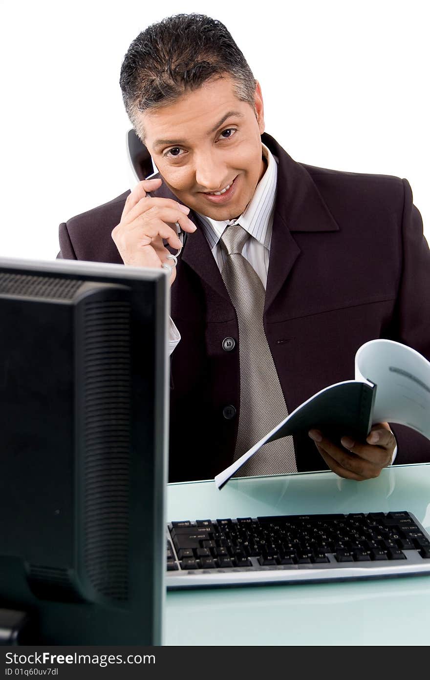 Front view of smiling businessman busy on phone on an isolated white background