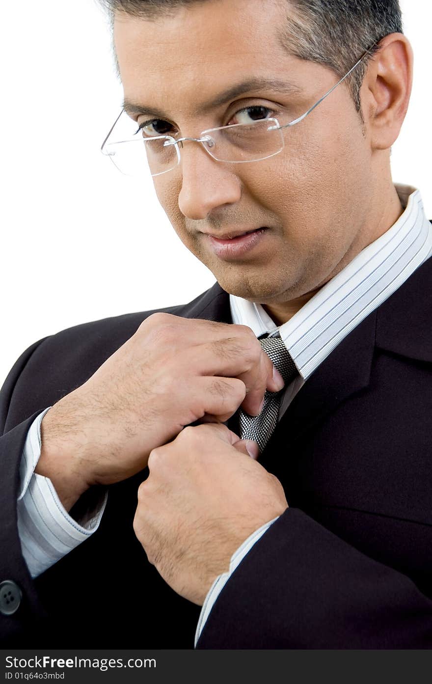 Portrait of manager holding his tie