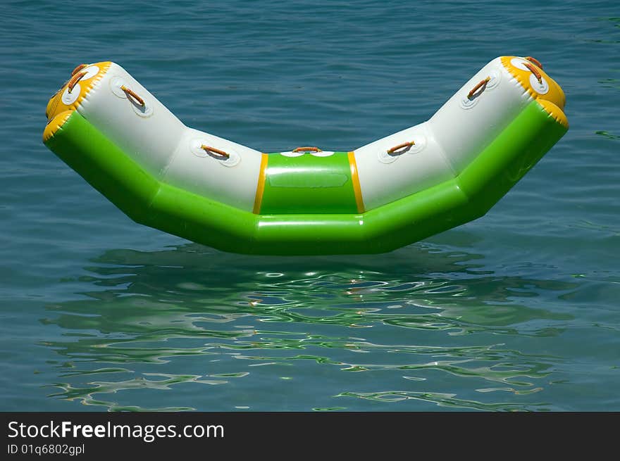 A colorful floating sunbed in the sea