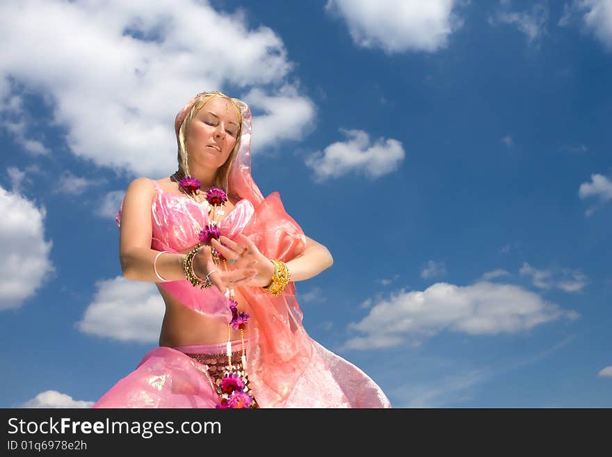 A woman dancing and a blue sky