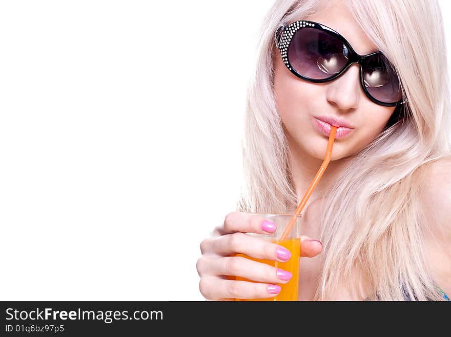 Beautiful women in swimsuit with a glass of juice on a white background isolated