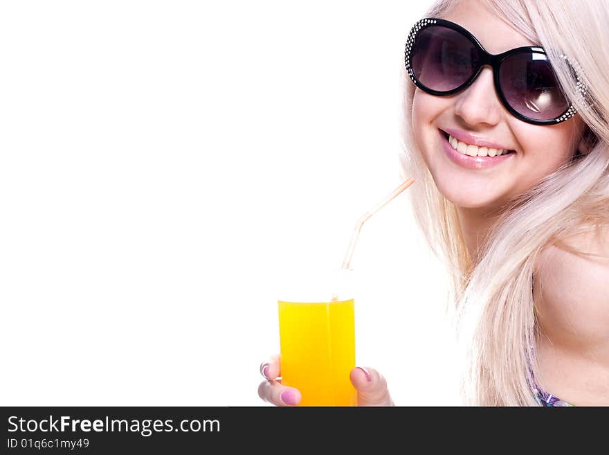 Beautiful women in swimsuit with a glass of juice