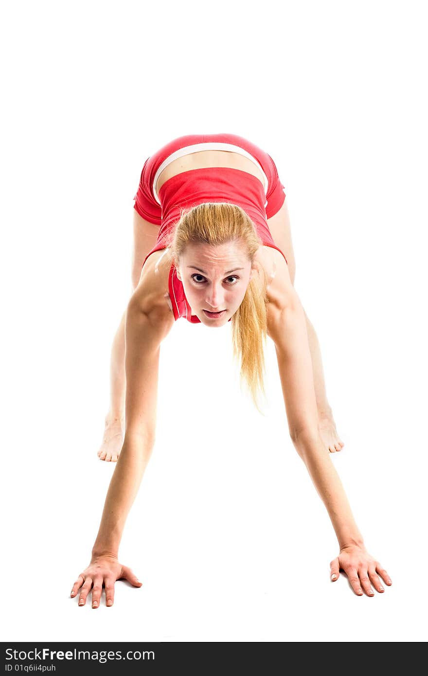 A pretty young blond girl in red underwear doing her gymnastic exercises. A pretty young blond girl in red underwear doing her gymnastic exercises