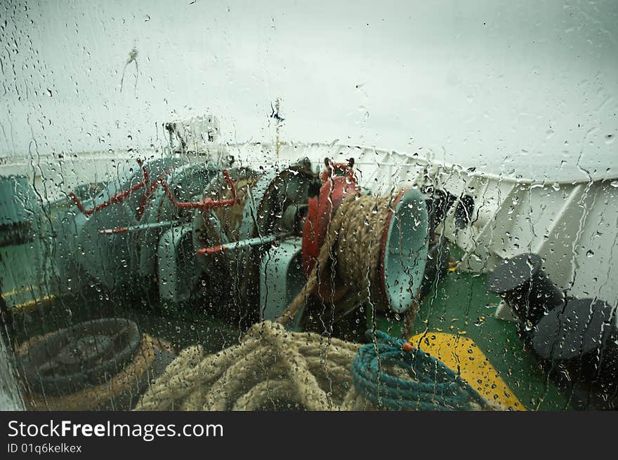 View of the front of a ship  in rainy weather. View of the front of a ship  in rainy weather