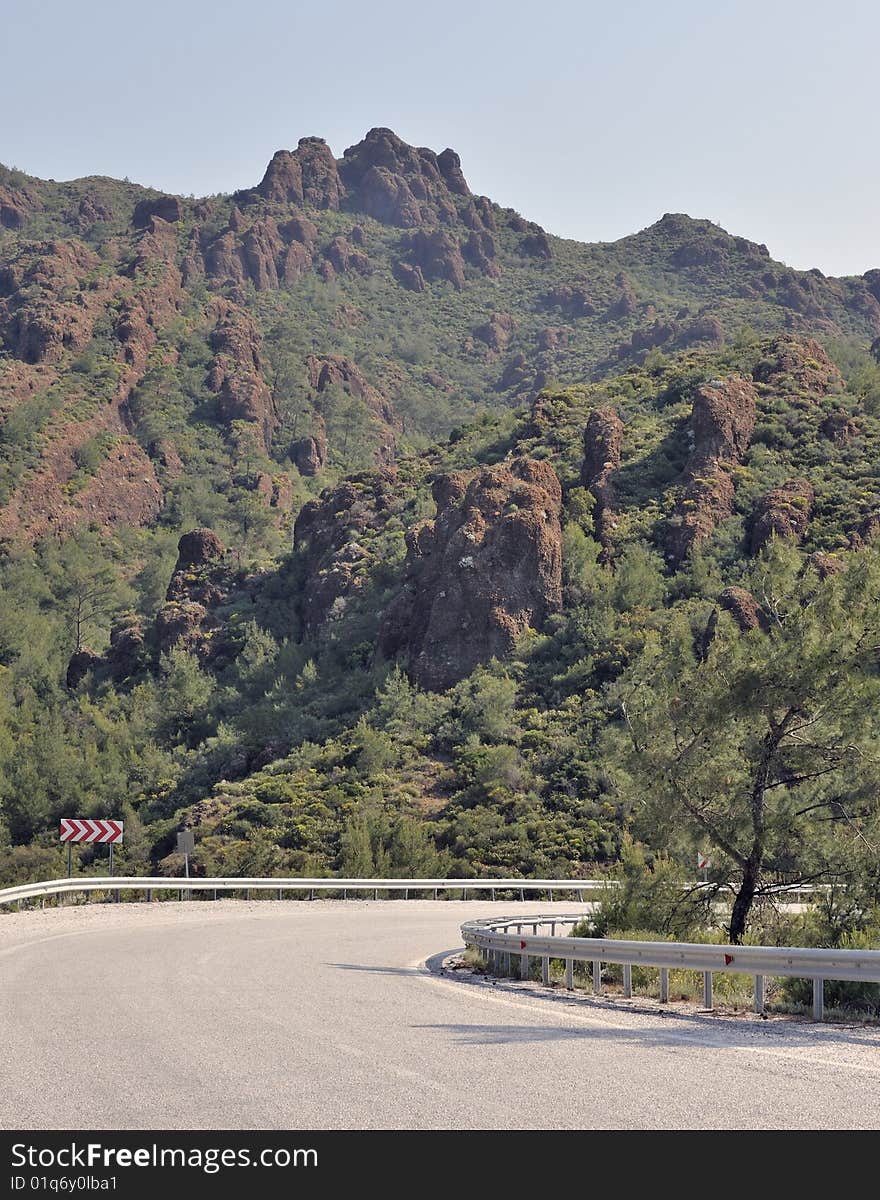 Bend in road through mountains