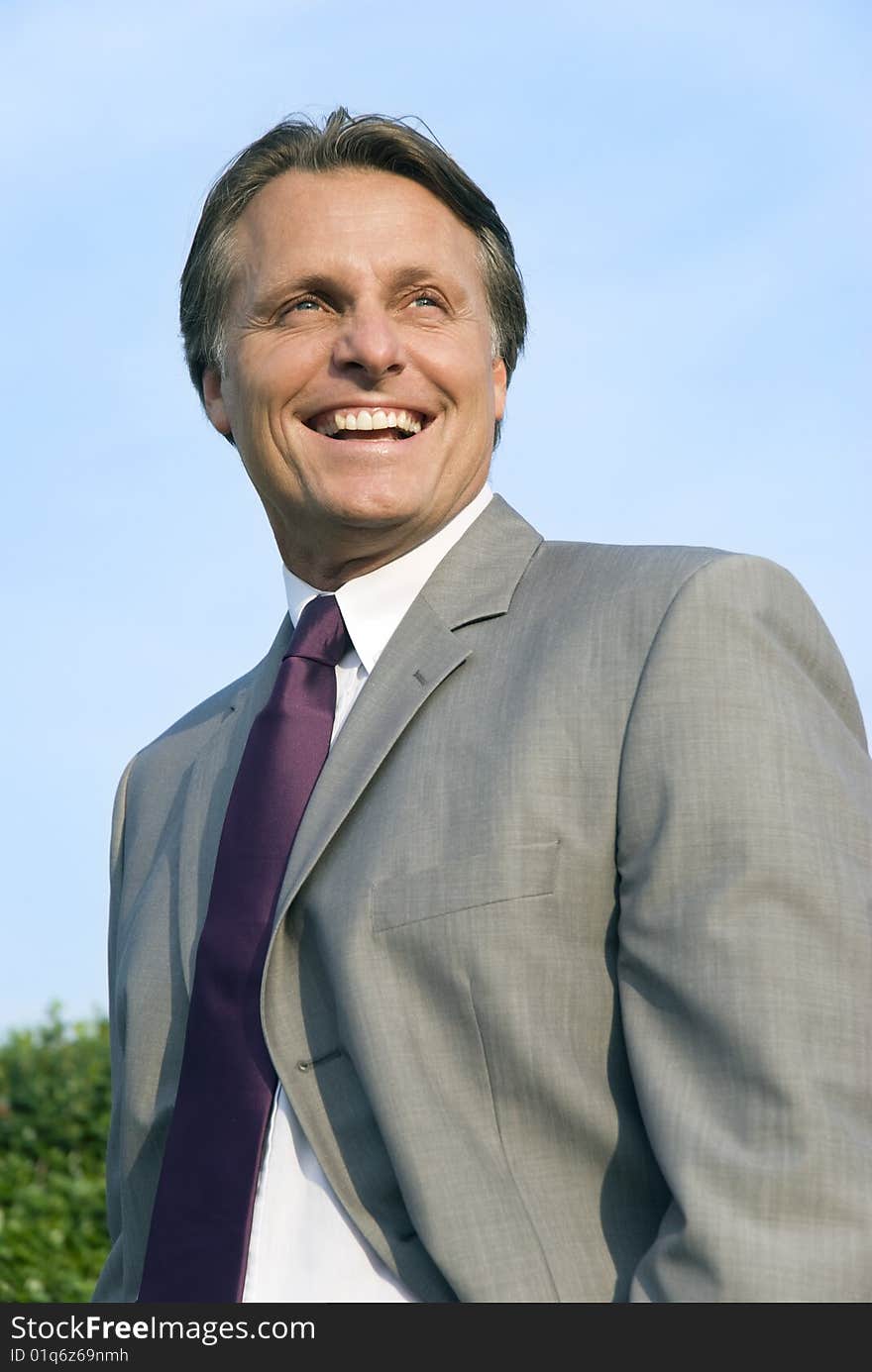 A color portrait of a happy smiling forties businessman. A color portrait of a happy smiling forties businessman.