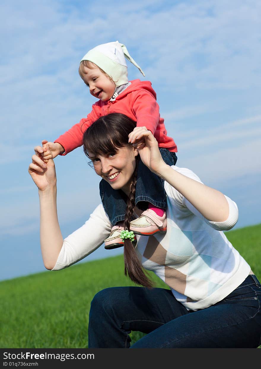 Portrait of a little girl with mom outdoors