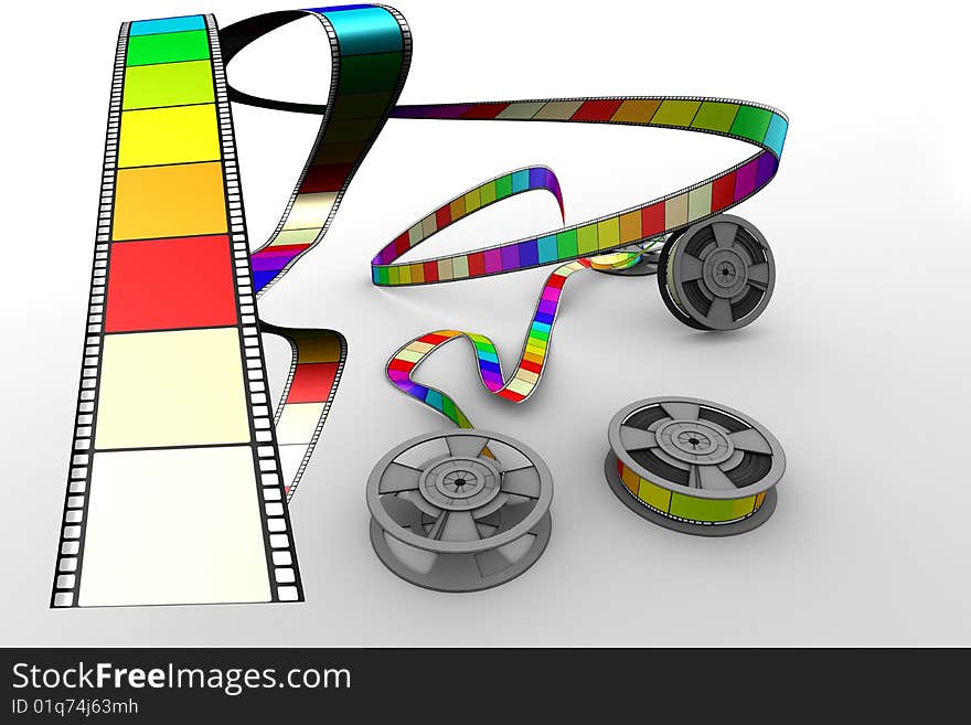 Three Filmreels on white floor shooting out coloured film. Three Filmreels on white floor shooting out coloured film