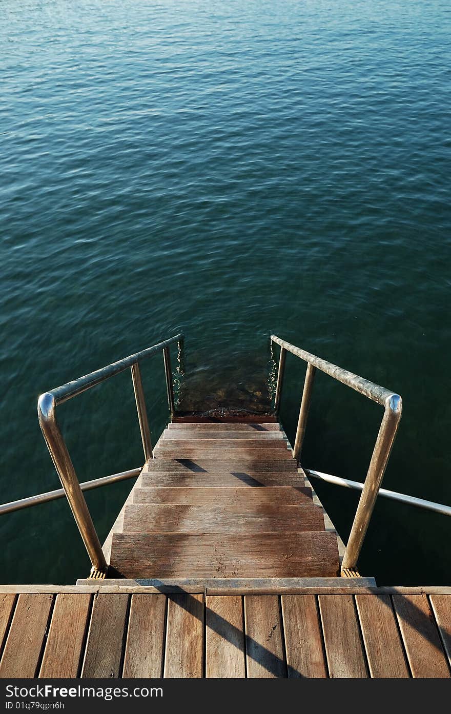 Wooden steps in the sea