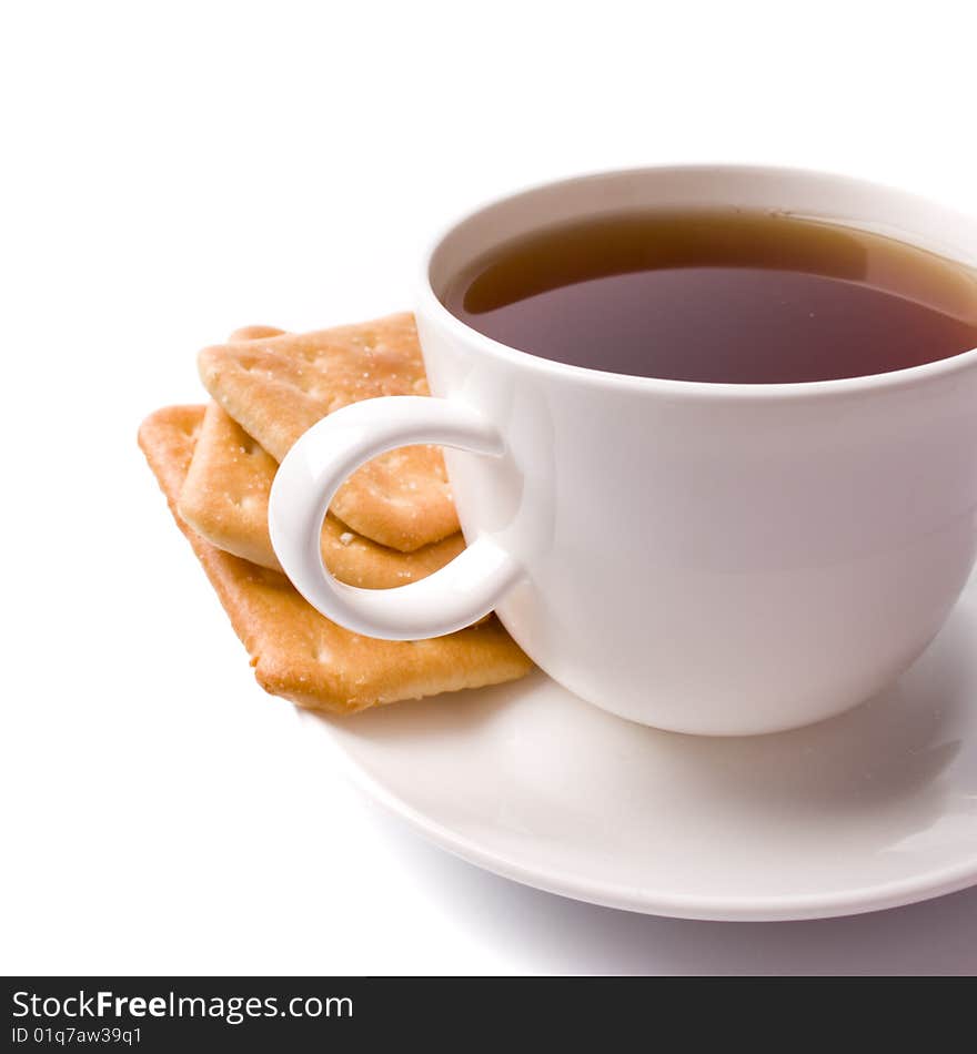 Cup of tea and some cookies on white background