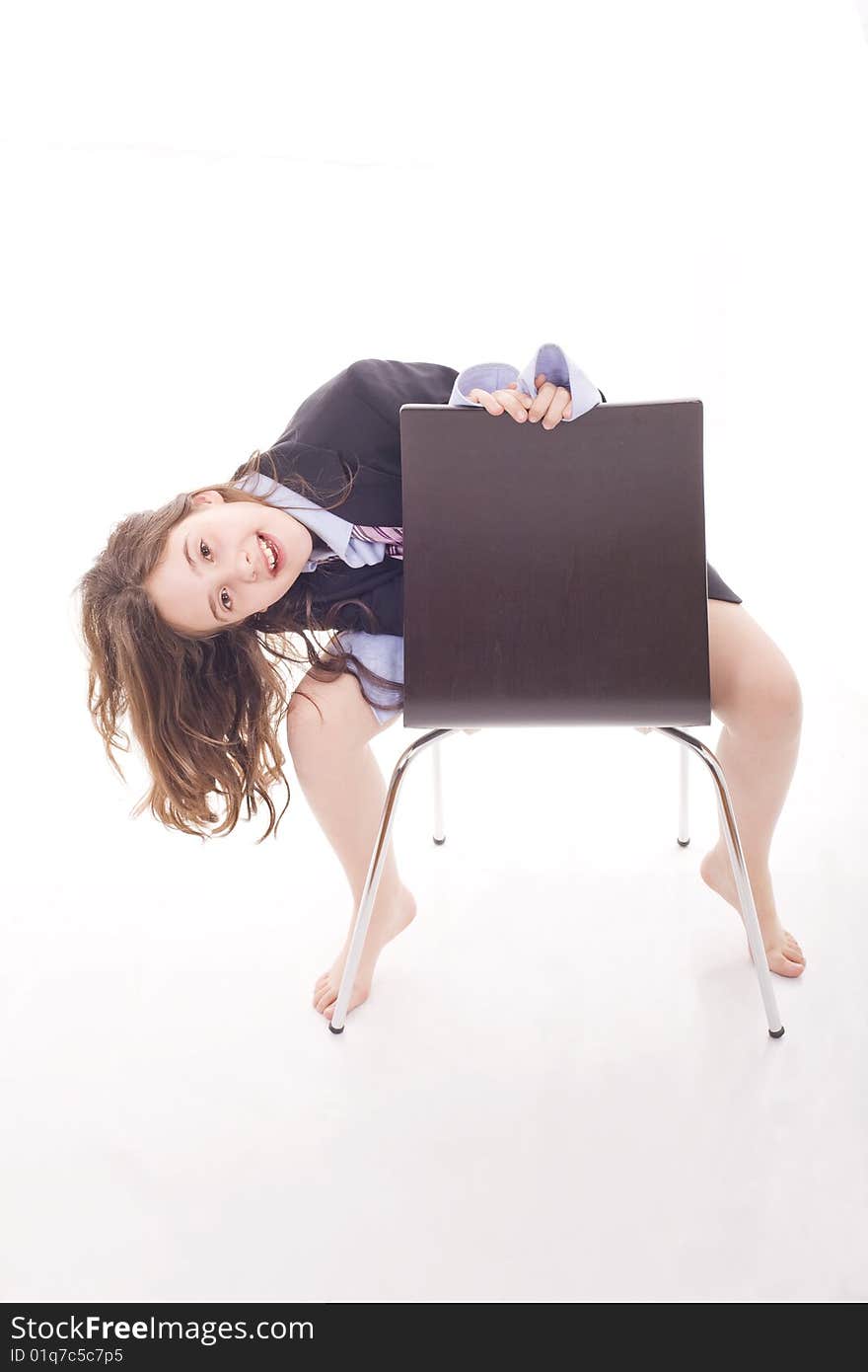 A young girl playing with adult's close and sited on a chair