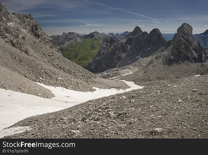 Sunshine and snow in a valley on the side of Valluga, high in the Austrian Alps. Sunshine and snow in a valley on the side of Valluga, high in the Austrian Alps.