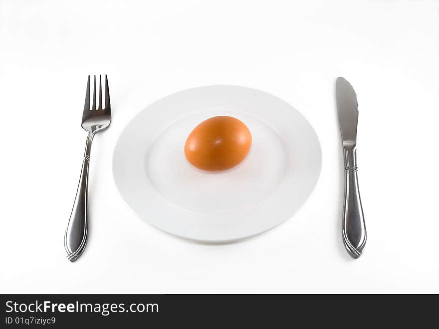 The egg lays on a white plate