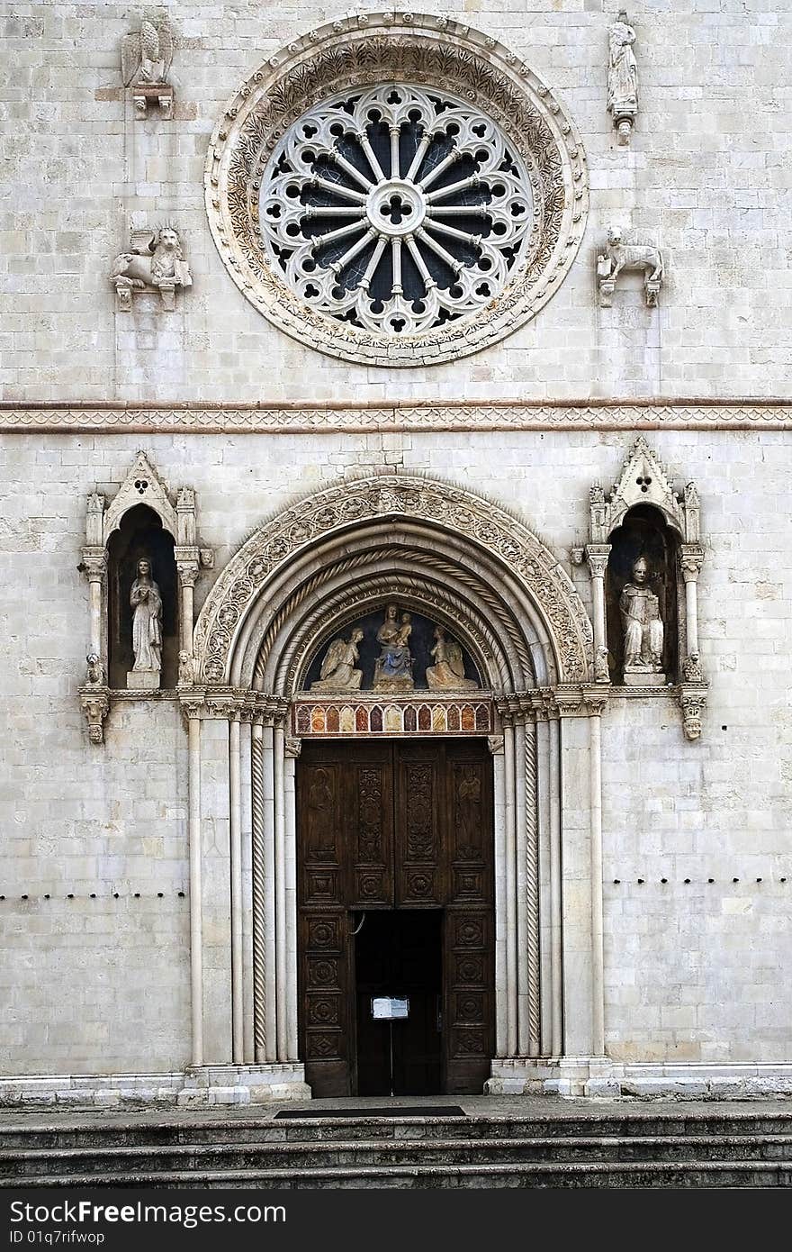 Portal and rose window of the church of St. Benedict (Umbria - Italy). Portal and rose window of the church of St. Benedict (Umbria - Italy)