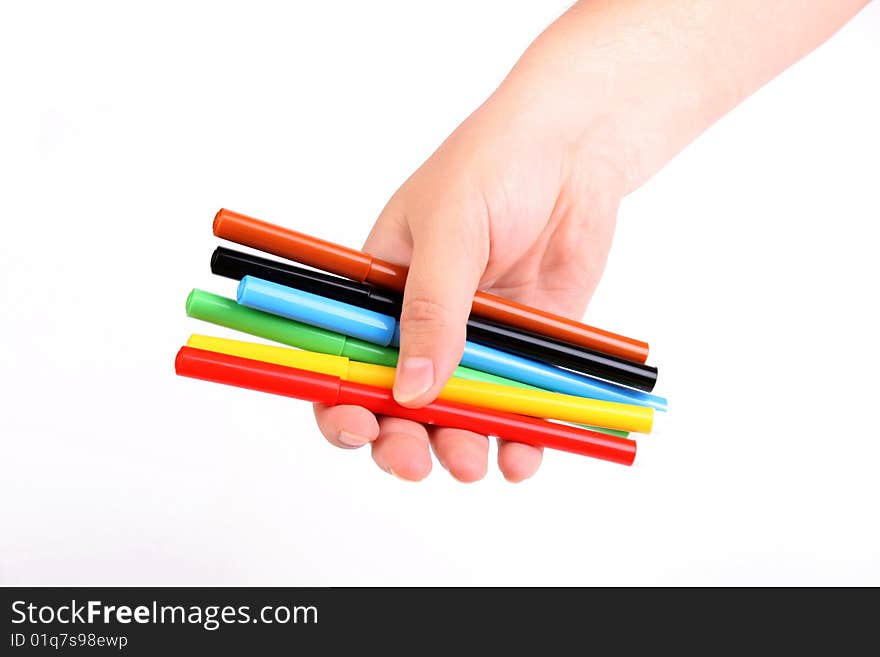 Woman holds colour felt-tip pens in a hand