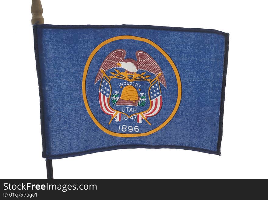 Toy flag of Utah State, making from cotton textile on white background. Toy flag of Utah State, making from cotton textile on white background.