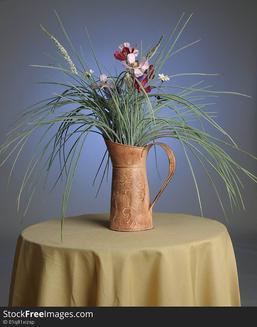 Decorative plant sitting on a glass table