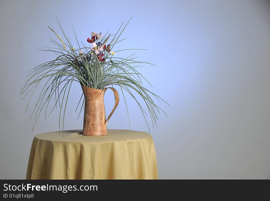 Decorative plant sitting on a glass table