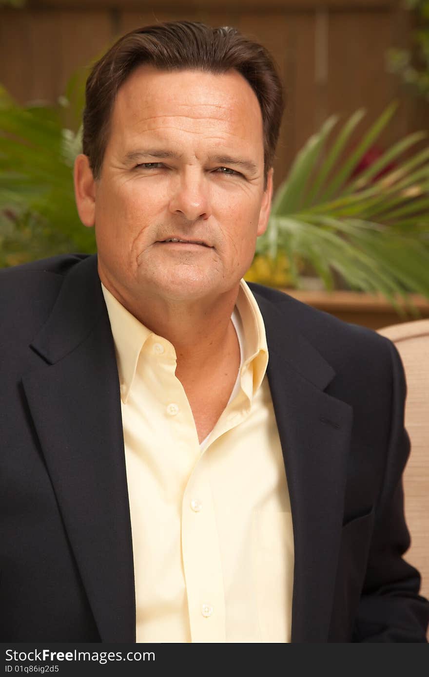 Handsome Male Portrait with Sport Coat in the Outdoors.