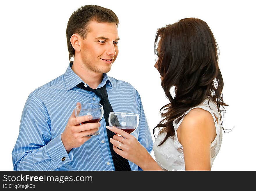 Happy young couple with wine glasses on white. Happy young couple with wine glasses on white