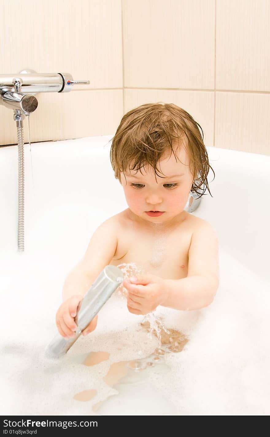 Sweet toddler baby girl in bath