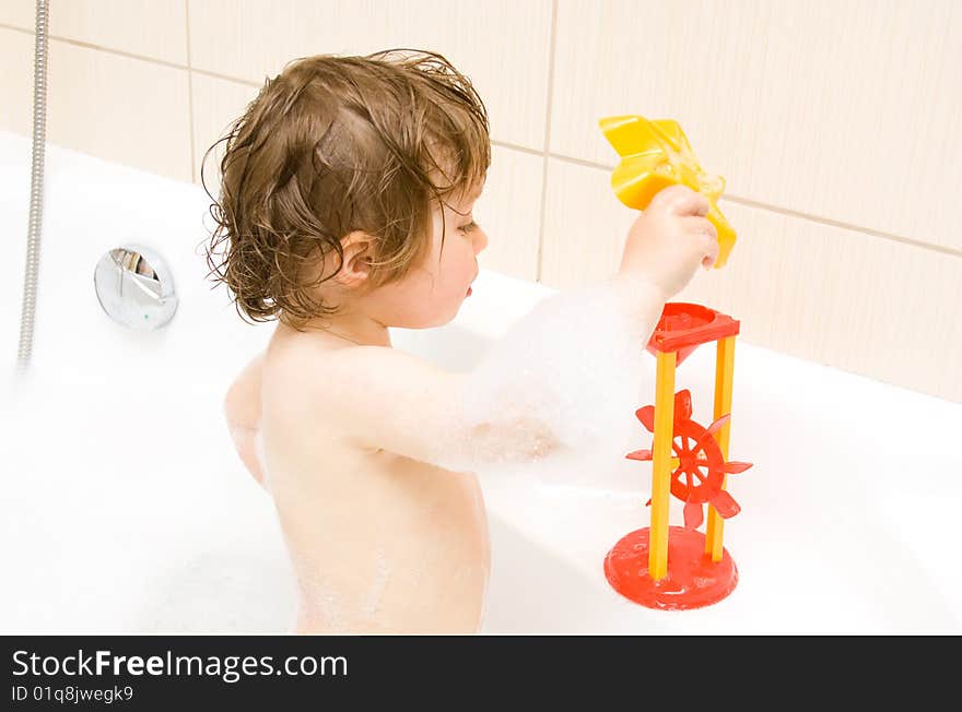 Sweet toddler baby girl in bath