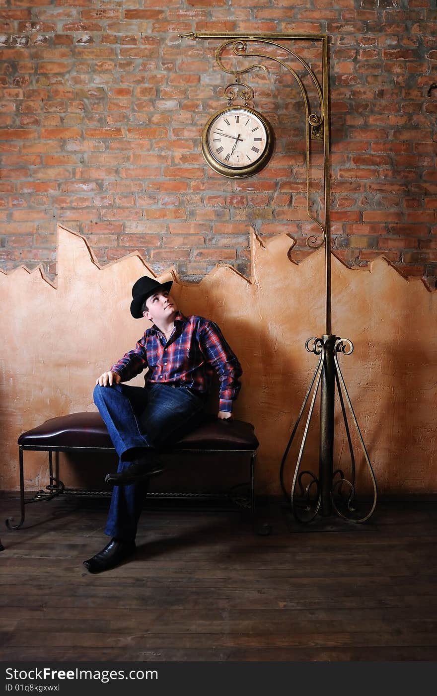 The guy in a cowboy's hat sit under hours. The participant of group StockDog. The guy in a cowboy's hat sit under hours. The participant of group StockDog