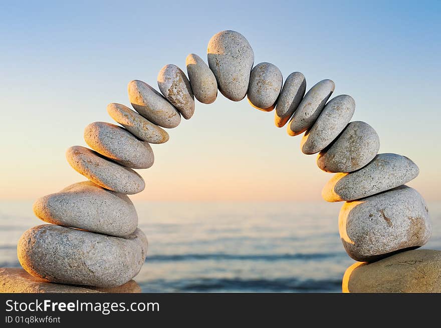 Arch of gravel in the morning sun ray