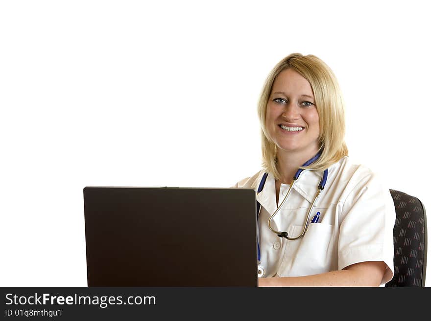 Medical doctor sits on desk and works with computer. Medical doctor sits on desk and works with computer