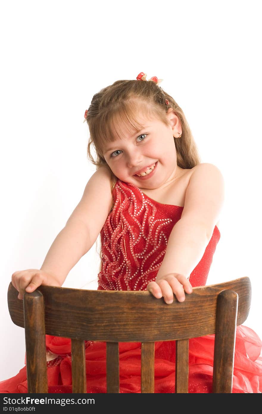 An image of nice girl on a brown chair. An image of nice girl on a brown chair